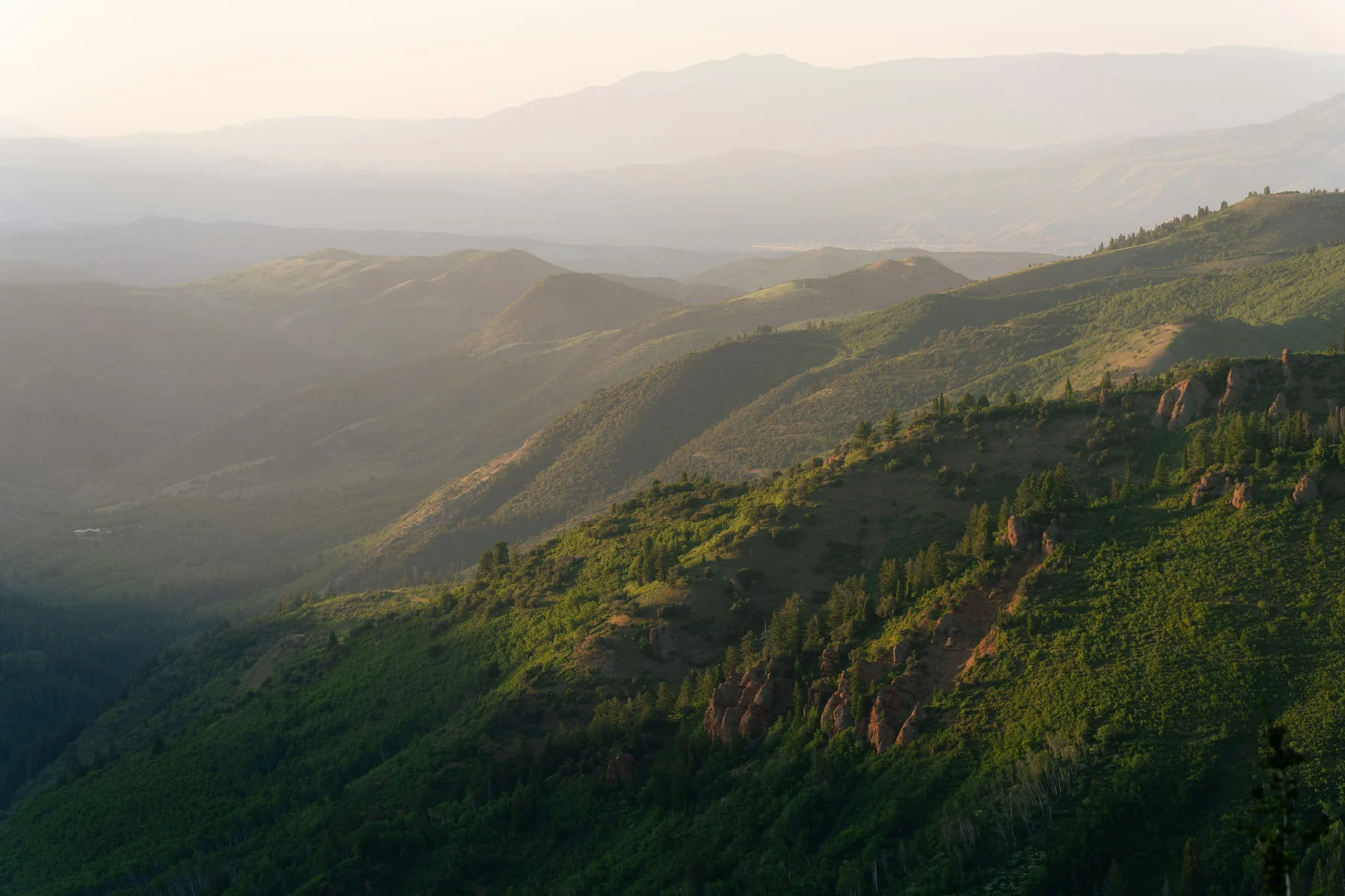 Illustrative Wasatch mountain landscape at dusk